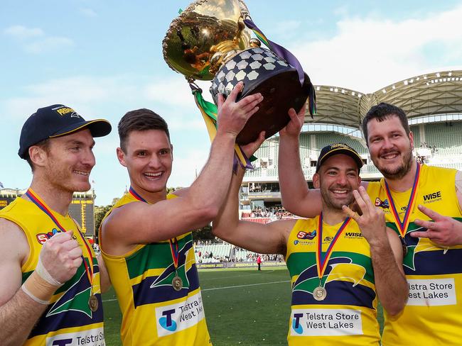 SANFL GRAND FINAL - Sunday, 3rd October, 2021. Glenelg v Eagles at The Adelaide Oval. Patrick Giuffreda of the Eagles and the three other players who have won 3 premierships - Luke Thompson, Jimmy Toumpas and Jarrad Redden Picture: Sarah Reed