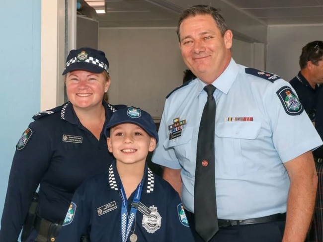 Senior Constable Linette Swales and Superintendent Garrath Channells with Christopher. Photo/QPS.