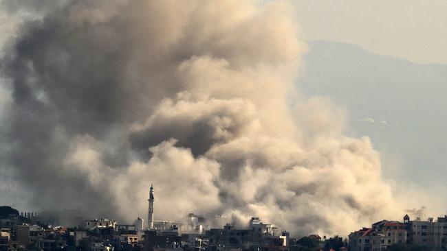 In this picture taken from Marjayoun, thick smoke rises from explosions as Israeli forces demolish dwellings in the border town of Khiam in southern Lebanon. Picture: AFP