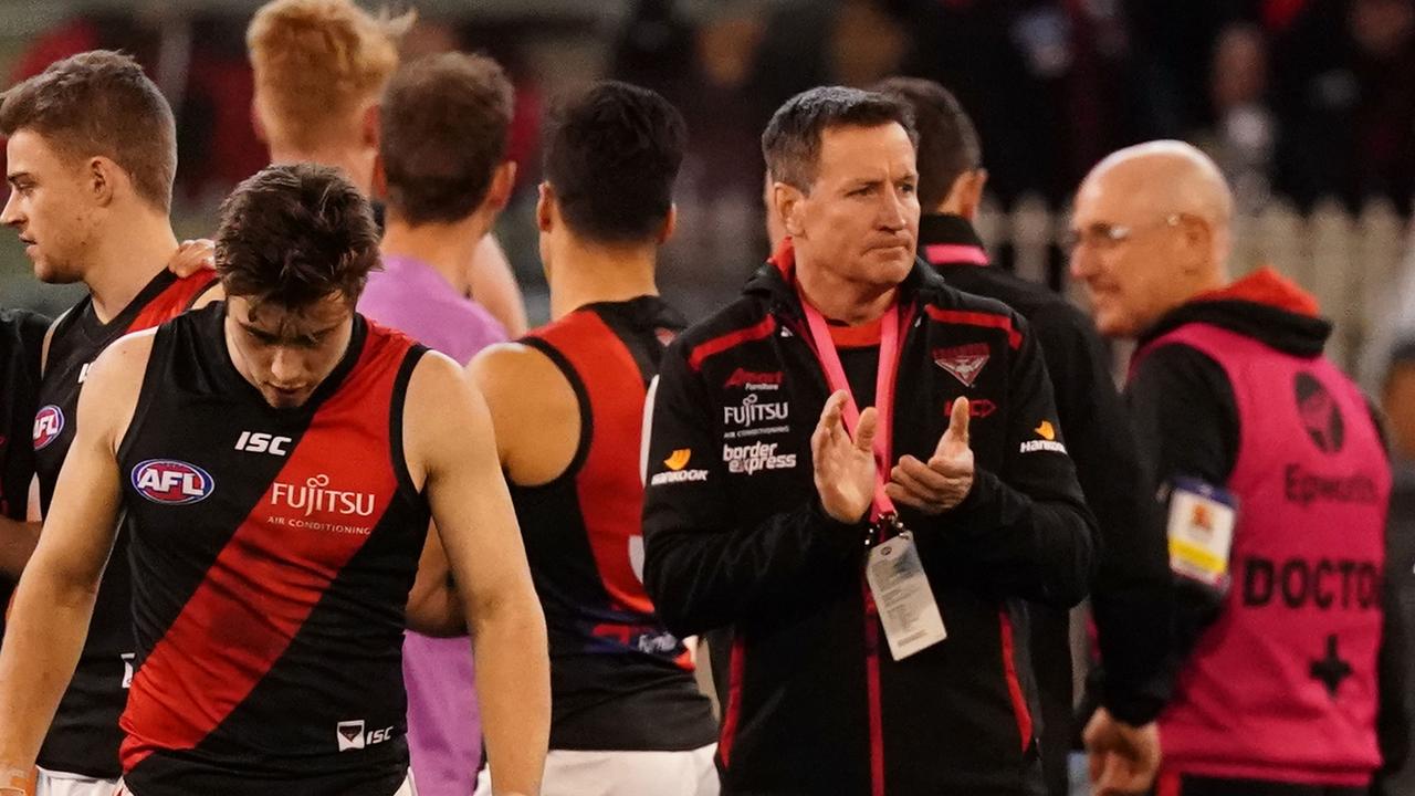 John Worsfold, coach of the Bombers speaks to his team during a quarter time break during a quarter time break during the Round 23 AFL match between the Collingwood Magpies and the Essendon Bombers at the MCG in Melbourne, Friday, August 23, 2019. (AAP Image/Scott Barbour) NO ARCHIVING, EDITORIAL USE ONLY