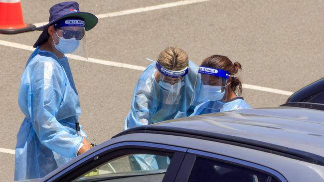 Nurses wearing personal protective clothing at a COVID-19 testing clinic. Picture: NCA NewsWire / Jenny Evans