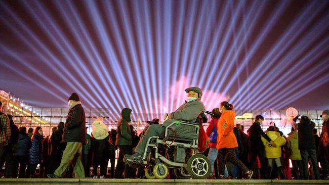 People walk on the banks of Yangtze River on New Year’s Eve in Wuhan. Picture: AFP