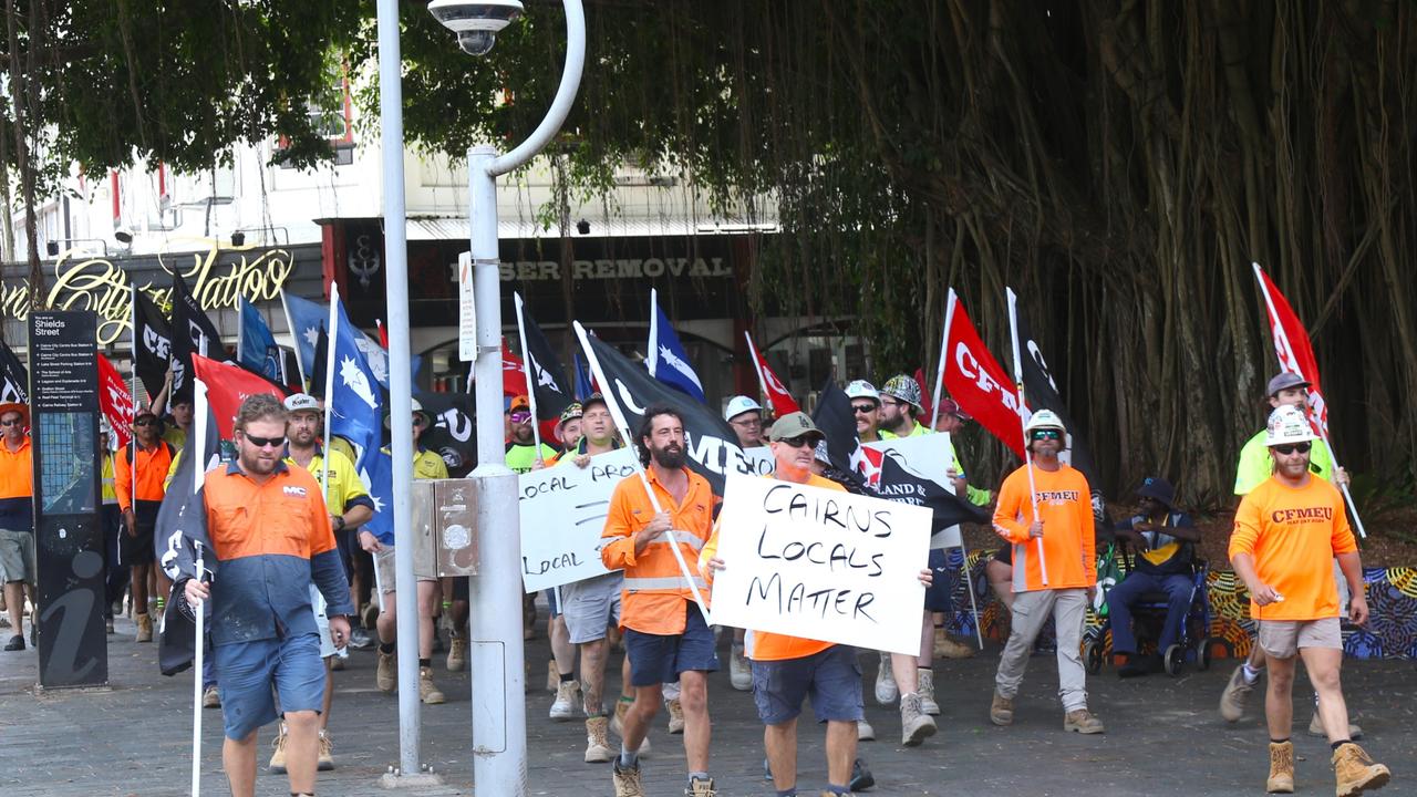 CFMEU, ETU and MWU members march down Lake St in the Cairns CBD en route to the offices of construction company John Holland. Picture: Peter Carruthers