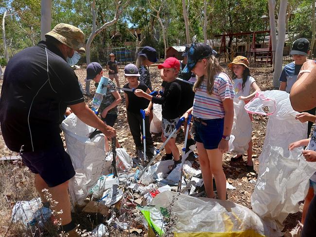 Enkindle Village School students learn how to find clues to establish the identity of illegal dumpers. Picture: Leighton Smith