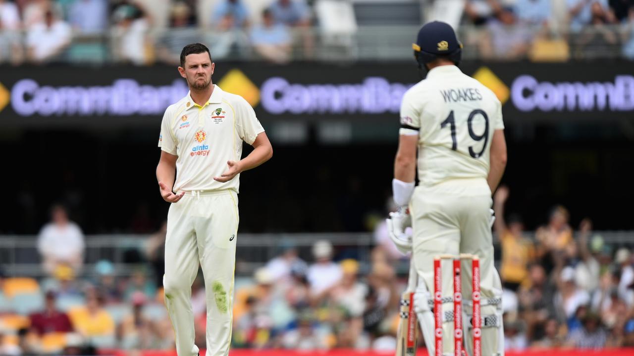 BRISBANE, AUSTRALIA - DECEMBER 08: Josh Hazlewood of Australia reacts after bowling during day one of the First Test Match in the Ashes series between Australia and England at The Gabba on December 08, 2021 in Brisbane, Australia. (Photo by Bradley Kanaris/Getty Images)