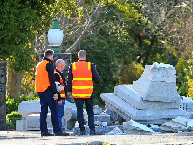 Officials survey the area after the crash. Picture: Mark Stewart