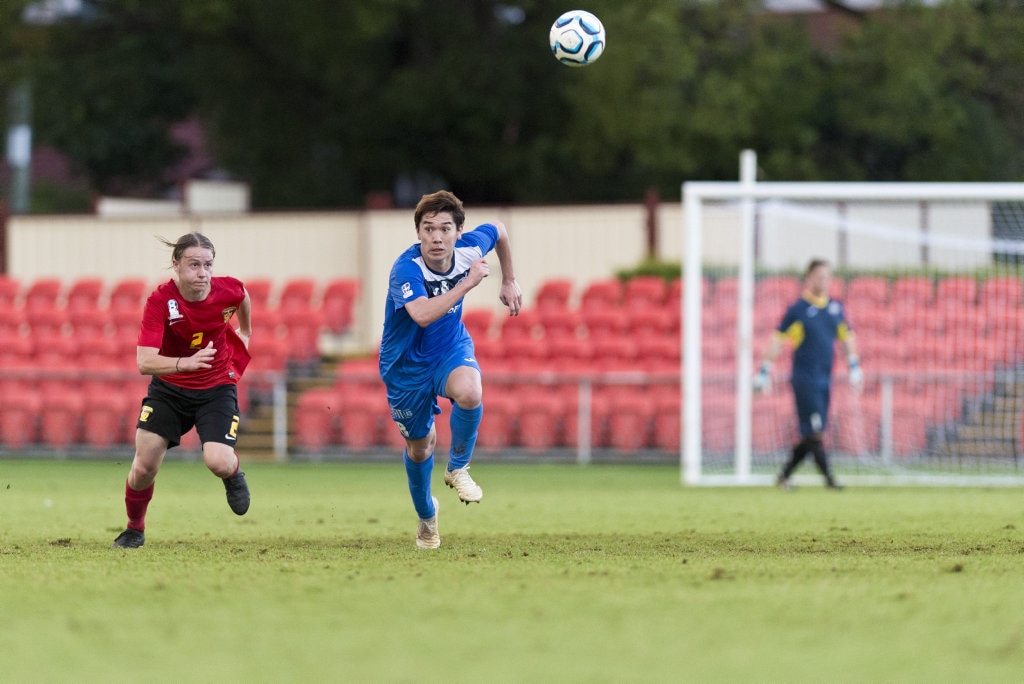 Sunshine Coast Fire player Harrisson Bowen (left) and Shota Aizawa of South West Queensland Thunder race to regain the ball in NPL Queensland men round nine football at Clive Berghofer Stadium, Saturday, March 30, 2019. Picture: Kevin Farmer