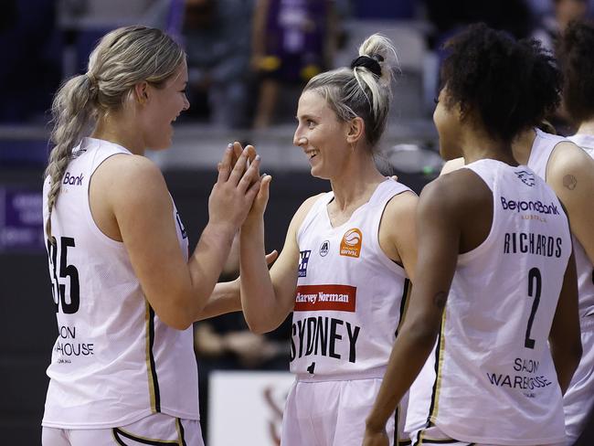 Isla Juffermans (left) celebrates with Lauren Nicholson after a big win over Melbourne. Photo: Daniel Pockett/Getty Images