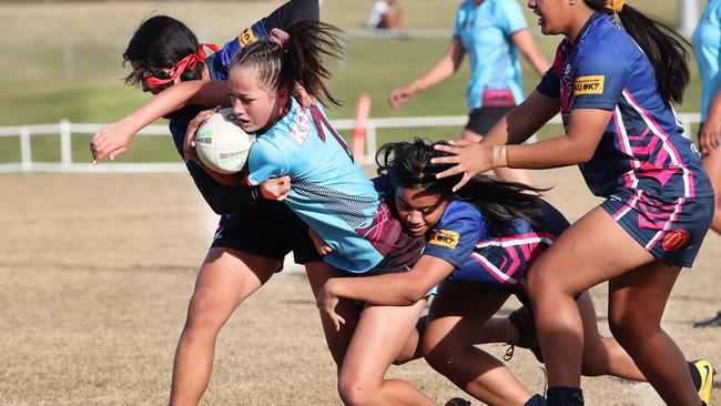 Grand final day of the Titans Schools League rugby league competition. Division One girls Keebra Park SHS v Mabel Park SHS. Keebra Park half Skye Raftstrand-Smith tackled by Mabel Park defence. Picture Glenn Hampson