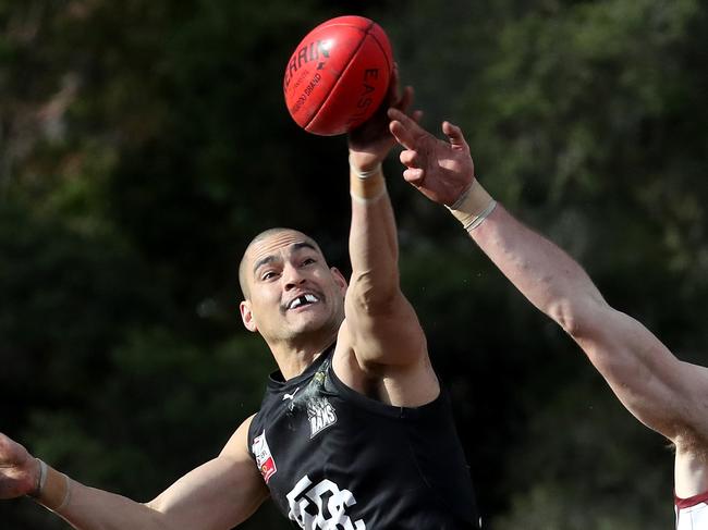 Jai Middleton of Burwood gets first hand to the ball during the EFL (Division 4) football match between  Whitehorse Pioneers and East Burwood at Springfield Park on Saturday 18th August, 2018.