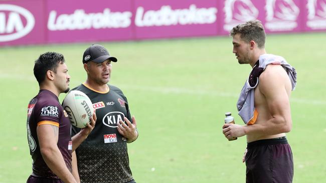 Corey Oates (R) talks with coach Anthony Seibold and captain Alex Glenn. Photographer: Liam Kidston.