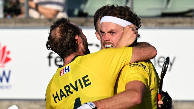 Australiaâs Cooper Burns (R) celebrates his goal with teammates during the men's field hockey match between Australia and the Netherlands in the FIH Hockey Pro League in Sydney on February 6, 2025. (Photo by Saeed KHAN / AFP) / -- IMAGE RESTRICTED TO EDITORIAL USE - STRICTLY NO COMMERCIAL USE --