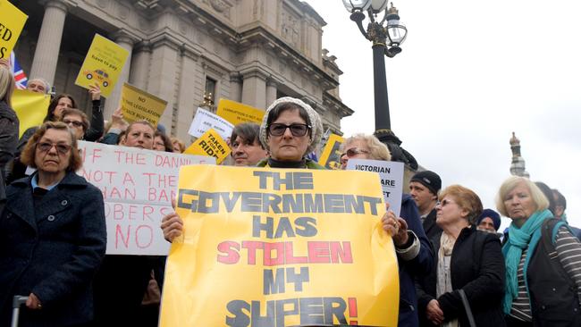Taxi drivers protest on the steps of Parliament House, Melbourne. Picture: Tracey Nearmy/AAP.