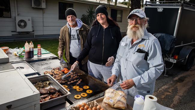 Footsteps clients Alan Collins, Melissa Gates and David cooking a BBQ at Port Augusta. Picture: Tom Huntley