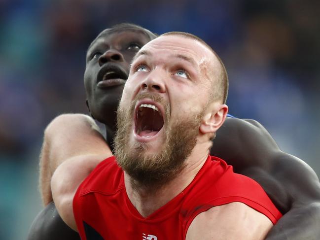 Majak Daw of the Kangaroos (left) and Max Gawn of the Demons during the round 19 AFL match between the North Melbourne Kangaroos and the Melbourne Demons at Blundstone Arena in Hobart, Saturday, July 29, 2017. (AAP Image/Rob Blakers) NO ARCHIVING, EDITORIAL USE ONLY1