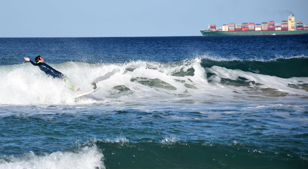 Surfers and bodyboard riders making the most of the waves at Kawana on the weekend. Picture: Mark Furler