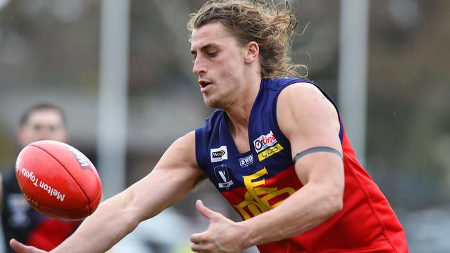 Diggers Rest's Patrick Jackson looks to gather possession. Picture: Josie Hayden