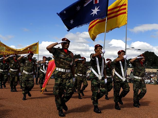 Veterans of the old Republic of Vietnam march in uniform during the Anzac Day National Service in front of the Australian War Memorial in Canberra. 