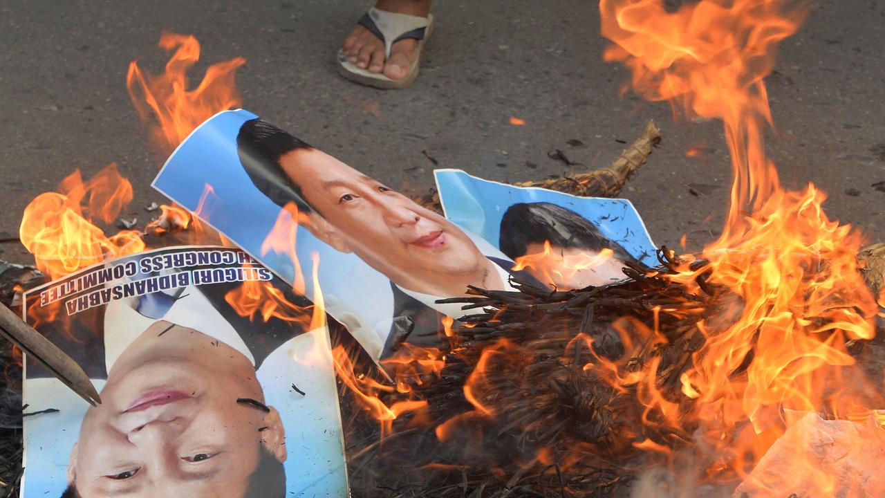Activists of Siliguri Youth Congress burn posters and effigy of Chinese President Xi Jinping during an anti-China protest in Siliguri following a fatal border conflict. Picture: Diptendu Dutta/AFP