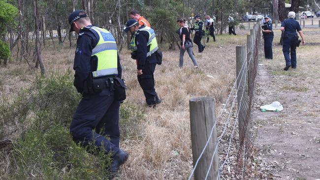 Police and SES crews conducting a line search in Bundoora Park. Picture: Tony Gough