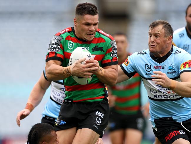 Rabbitoh's James Roberts and Cronulla's Josh Morris during NRL match between the South Sydney Rabbitohs and the Cronulla Sharks at ANZ Stadium. Picture. Phil Hillyard