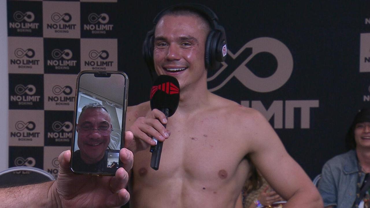 Kostya Tszyu on the phone after Tim's world title defence against Brian Mendoza.