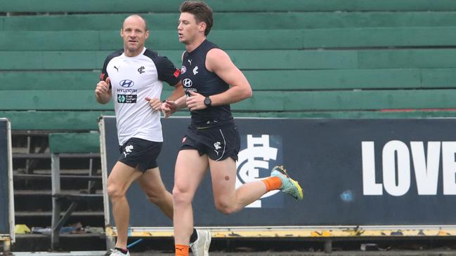 Sam Walsh runs the boundary at training as he continues to make progress from back surgery.