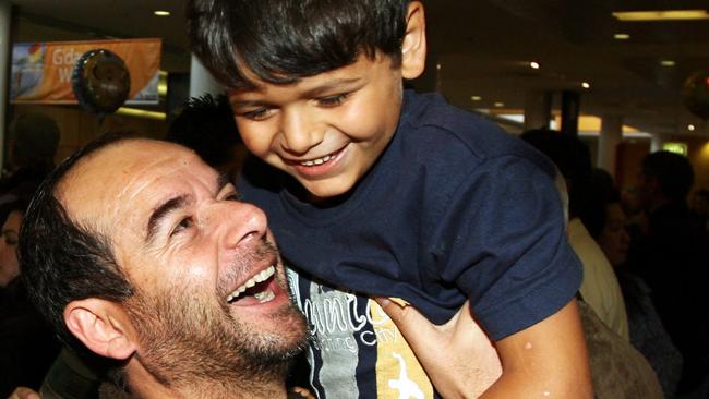 Fadi Hijazi hugs his nephew, Hadi Hijazi, at Sydney Airport on arrival from Lebanon in July 2006.