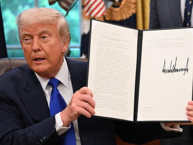 US President Donald Trump speaks to the media while signing executive orders in the Oval Office of the White House, in Washington, DC, on May 5, 2025. Trump signed several health care-related executive orders, according to a White House statement. (Photo by Alex Wroblewski / AFP)