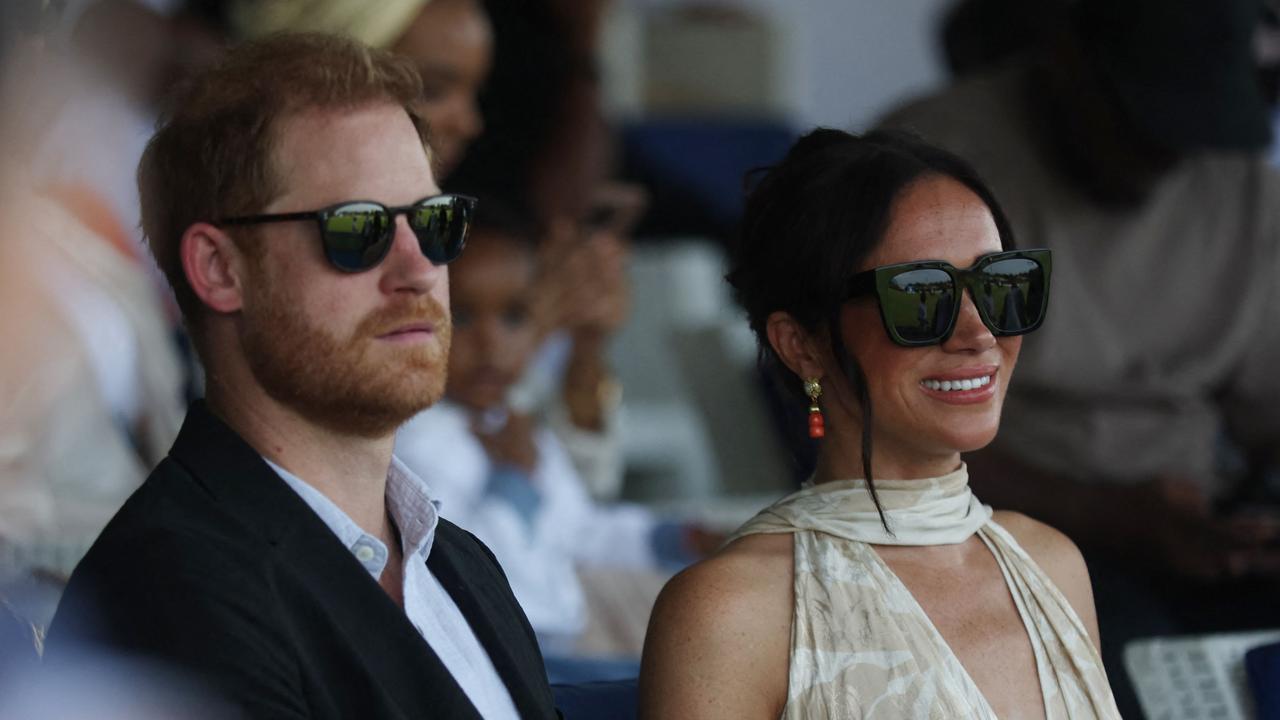 Britain's Prince Harry (L), Duke of Sussex, and Britain's Meghan (R), Duchess of Sussex, attend a charity polo game at the Ikoyi Polo Club in Lagos on May 12, 2024 as they visit Nigeria as part of celebrations of Invictus Games anniversary. (Photo by Kola Sulaimon / AFP)