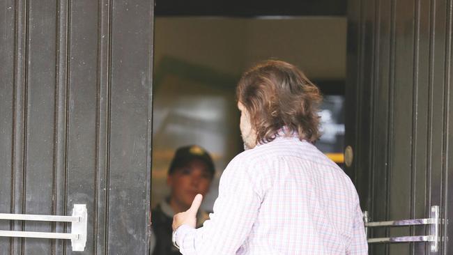 An employee arrives at head office in Pyrmont. Picture: John Grainger