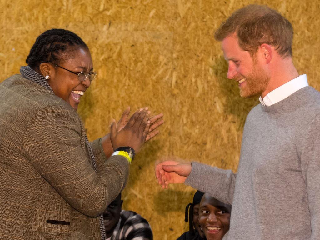 Britain’s Prince Harry meets radio DJ Remi Aderemi, 24, during a visit to Reprezent 107.3FM community radio station in Brixton, south west London on January 9, 2018. Picture: AFP