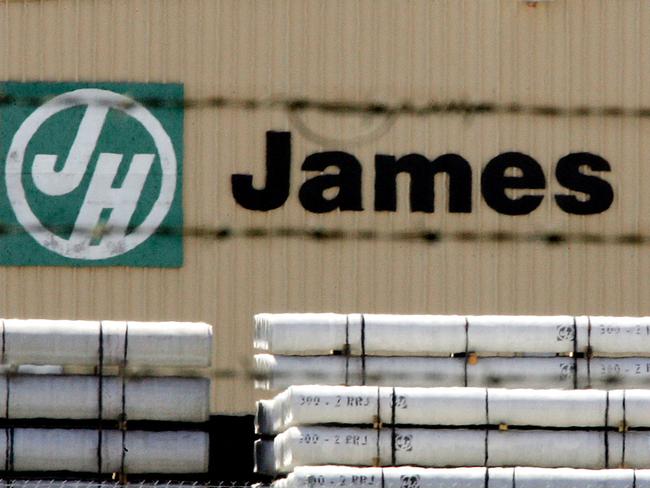 FILE PHOTO: A James Hardie factory is seen behind a fence in western Sydney September 24, 2004.  REUTERS/Tim Wimborne/File Photo