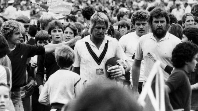 Jeff Thomson trudges off the MCG after the thrilling finish to the 1982 Test.