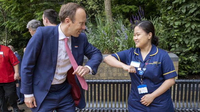 Matt Hancock observes social distancing when meeting NHS hospital staff in London on June 17. Picture: Steve Reigate-WPA Pool/Getty Images