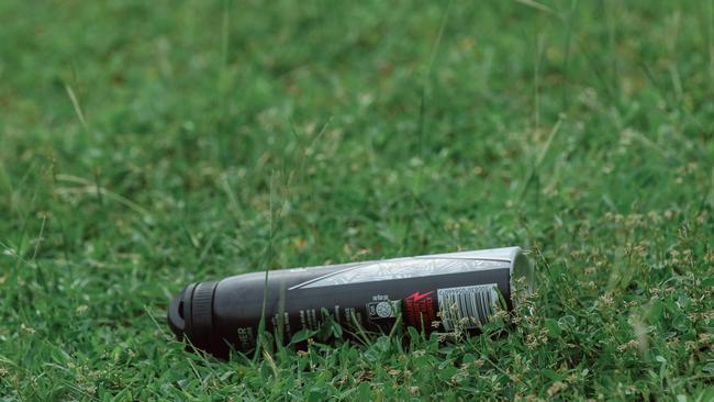 Multiple aerosol cans litter Karama. Picture: Glenn Campbell