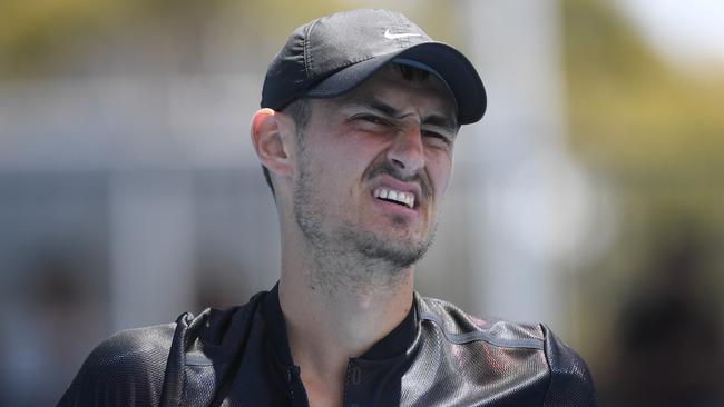 Bernard Tomic reacts against Lorenzo Sonego in the qualifying tournament for the Australian Open. Picture: AAP