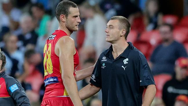 Jarrod Witts chats with Patrick Cripps after their round 4 match where the Carlton superstar suffered a hamstring injury. Picture: AFL Photos via Getty Images