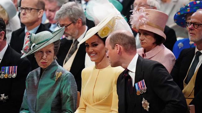 Britain's Princess Anne, Princess Royal, (L), Catherine, Duchess of Cambridge, (C) and Prince William, Duke of Cambridge (R) ain church.