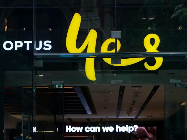 SYDNEY, AUSTRALIA - NOVEMBER 21: The Optus company sign and logo are displayed in a store window in the CBD on November 21, 2023 in Sydney, Australia. Optus' CEO Kelly Bayer Rosmarin stepped down on Monday after an extended outage last week caused millions of Australians to be disconnected from the network, with no access to emergency numbers for hours. The outage followed a hack that saw millions of customers' data shared online last year. (Photo by Lisa Maree Williams/Getty Images)