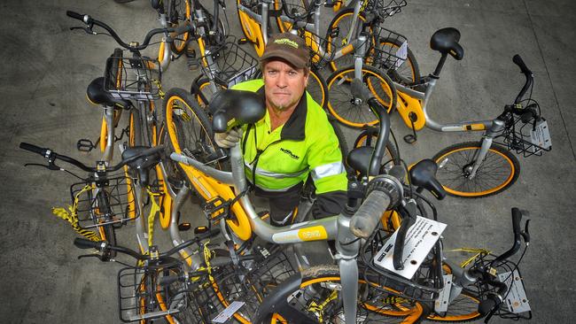 Driver Wayne Kirk gets ready to tow abandoned oBikes. Picture: Tony Gough