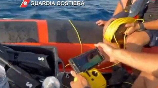 Rescuers operate the underwater drone robot from the surface. Picture: Guardia Costeria