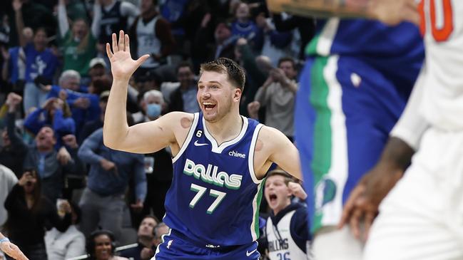 DALLAS, TEXAS - DECEMBER 27:  Luka Doncic #77 of the Dallas Mavericks reacts after making the game tying basket against the New York Knicks with one second left in regulation to send the game to overtime at American Airlines Center on December 27, 2022 in Dallas, Texas. NOTE TO USER: User expressly acknowledges and agrees that, by downloading and or using this photograph, User is consenting to the terms and conditions of the Getty Images License Agreement.  (Photo by Tim Heitman/Getty Images)