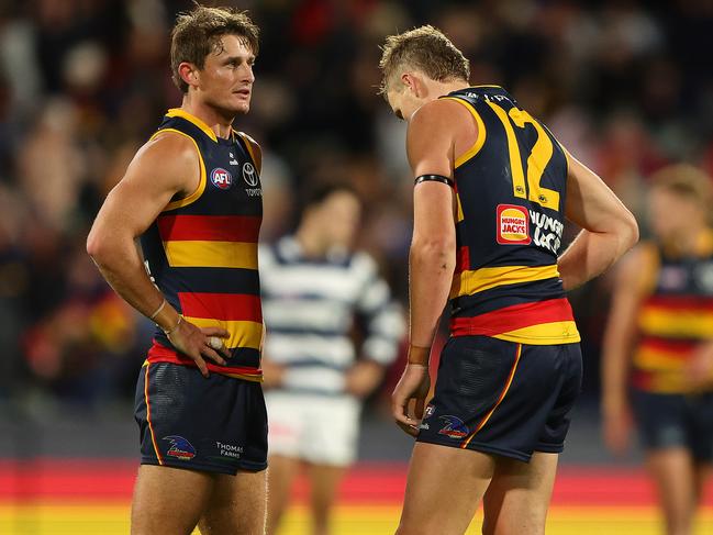 ADELAIDE, AUSTRALIA - MARCH 22: Matt Crouch ad Jordan Dawson of the Crows after the loss during the 2024 AFL Round 2 match between the Adelaide Crows and the Geelong Cats at Adelaide Oval on March 22, 2024 in Adelaide, Australia. (Photo by Sarah Reed/AFL Photos via Getty Images)