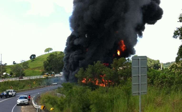 A truck burns after crashing into a guard rail on the Pacific Highway about 10km north of Ballina . Picture: Tony Gilding