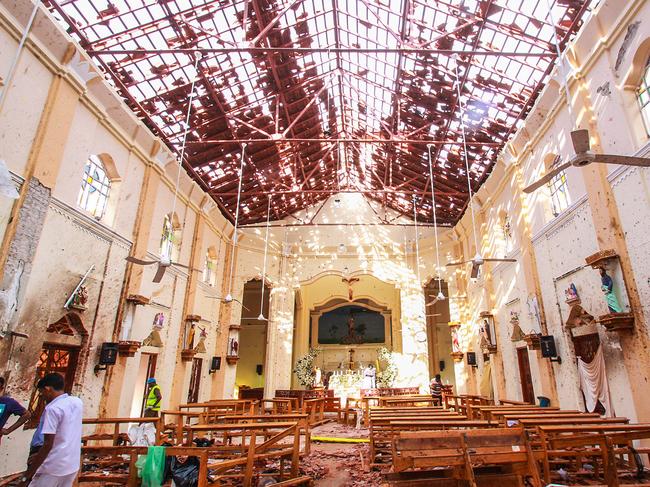 Officials inspect St. Sebastian's Church near Colombo, after multiple explosions. Police have revealed they were warned of possible attacks. Picture: Getty Images