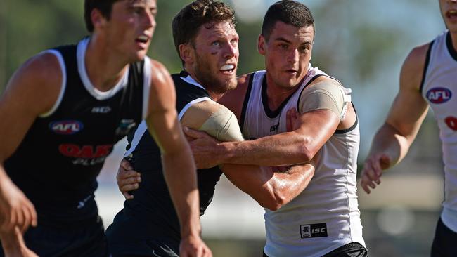 MIDFIELD FORCE: Brad Ebert and Tom Rockliff go head-to-head in Port Adelaide's internal trial. Picture: Tom Huntley.