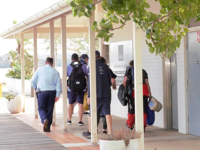 The crew of the retired super yacht Bowline with police at Batemans Bay. Picture: NewsWire/ Hayley Jansen