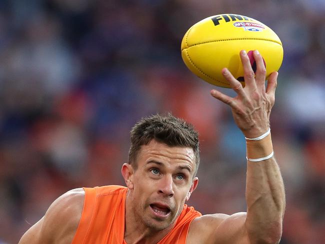 Giants Brett Deledio tackled by Western Bulldogs Hayden Crozier during the AFL Elimination match between the GWS Giants and Western Bulldogs at Giants Stadium. Picture. Phil Hillyard