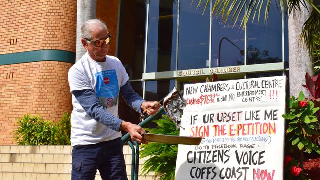 George Partos burning his rates notice outside Coffs Harbour City Council chambers on September 28. He held another protest outside chambers this afternoon.